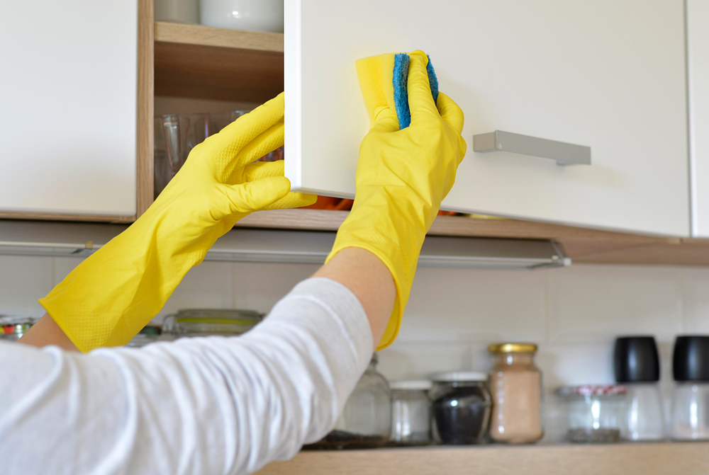 How do you clean kitchen cabinets without removing the finish